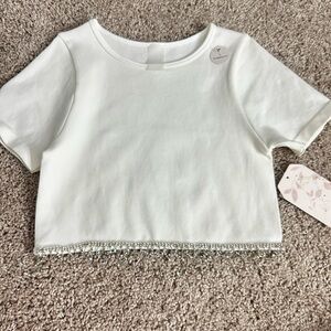 Stylish white boxy top with gemstones hanging🤎